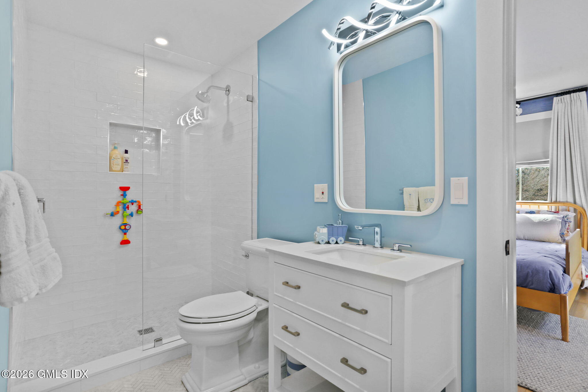 10 Lockwood Road Riverside, CT 06878 - Photo 28 of 38 a bathroom with a sink vanity mirror and toilet