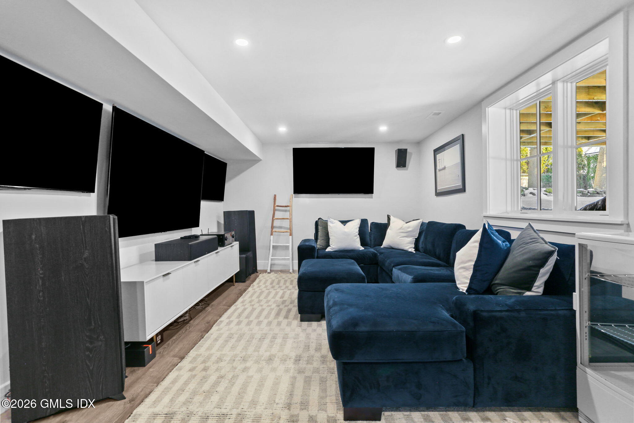 10 Lockwood Road Riverside, CT 06878 - Photo 35 of 38 a living room with furniture and a flat screen tv