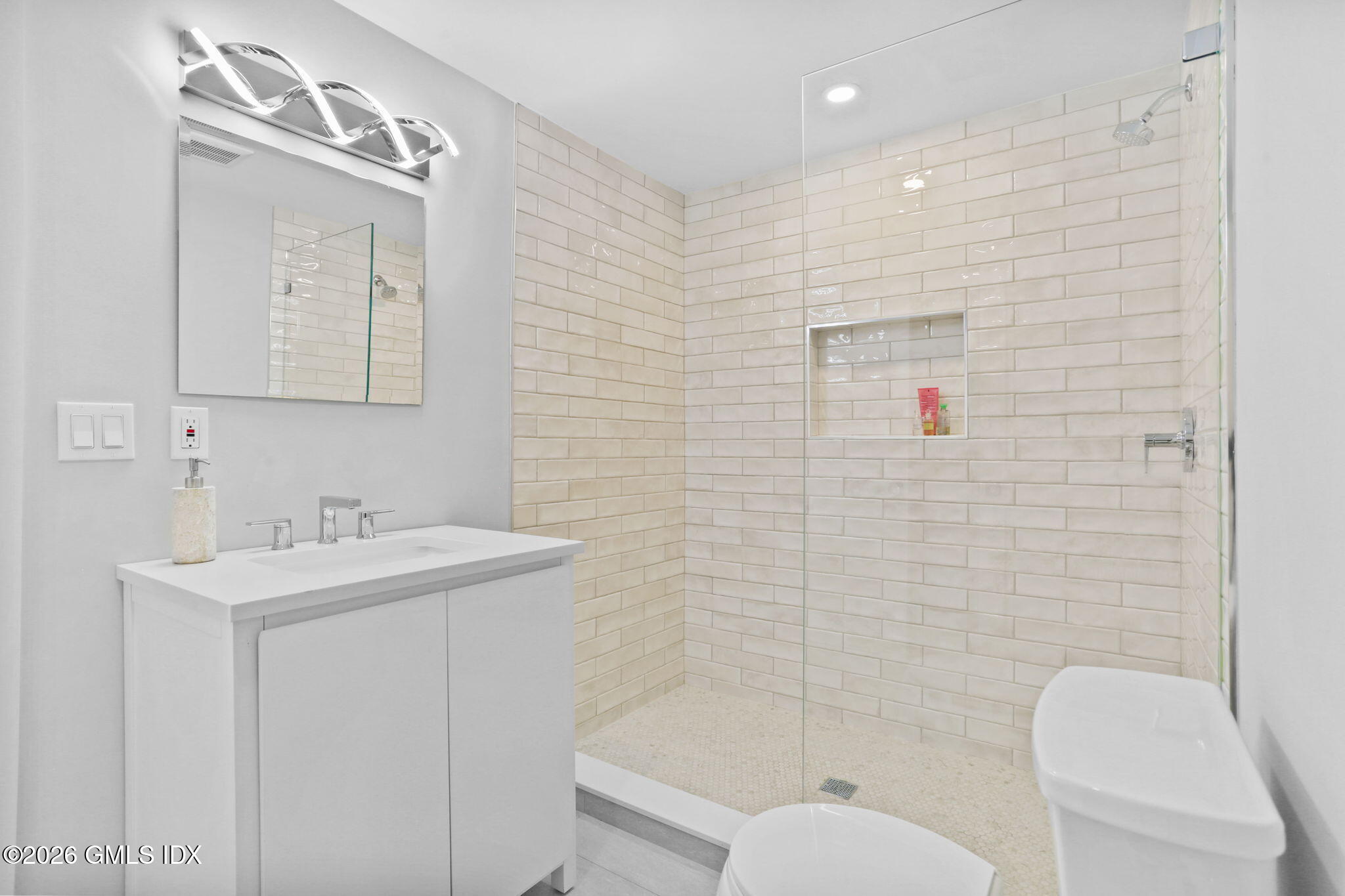 10 Lockwood Road Riverside, CT 06878 - Photo 36 of 38 a bathroom with a sink a toilet and shower