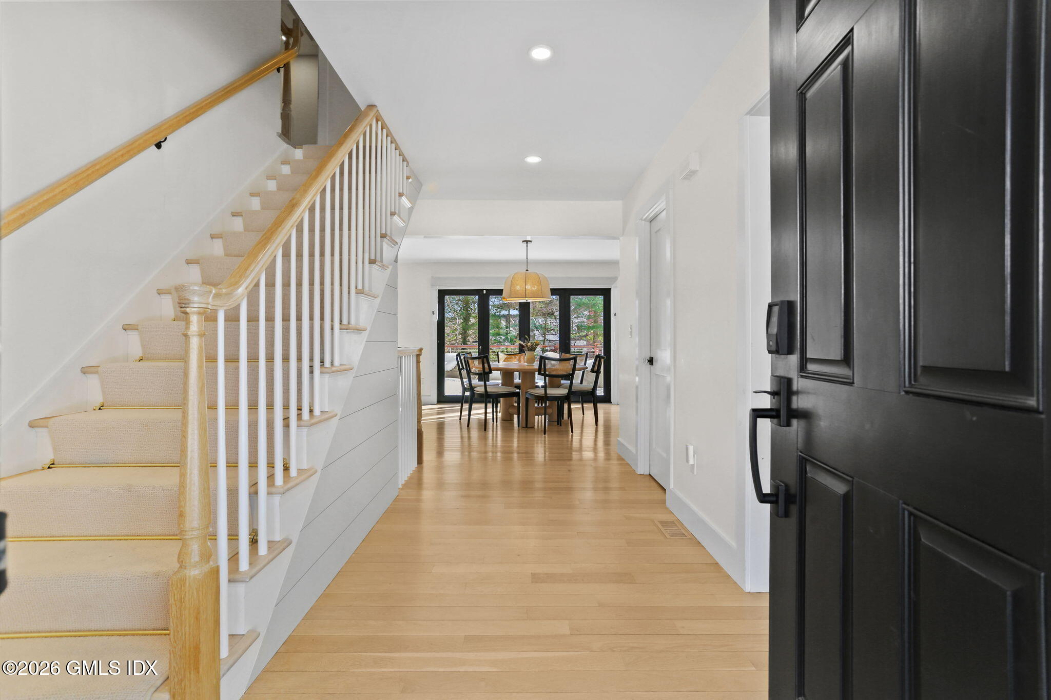 10 Lockwood Road Riverside, CT 06878 - Photo 4 of 38 a view of a hallway with wooden floor and furniture