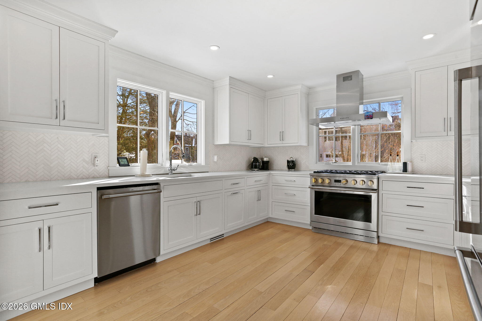 10 Lockwood Road Riverside, CT 06878 - Photo 7 of 38 a kitchen with stainless steel appliances granite countertop a stove and a sink