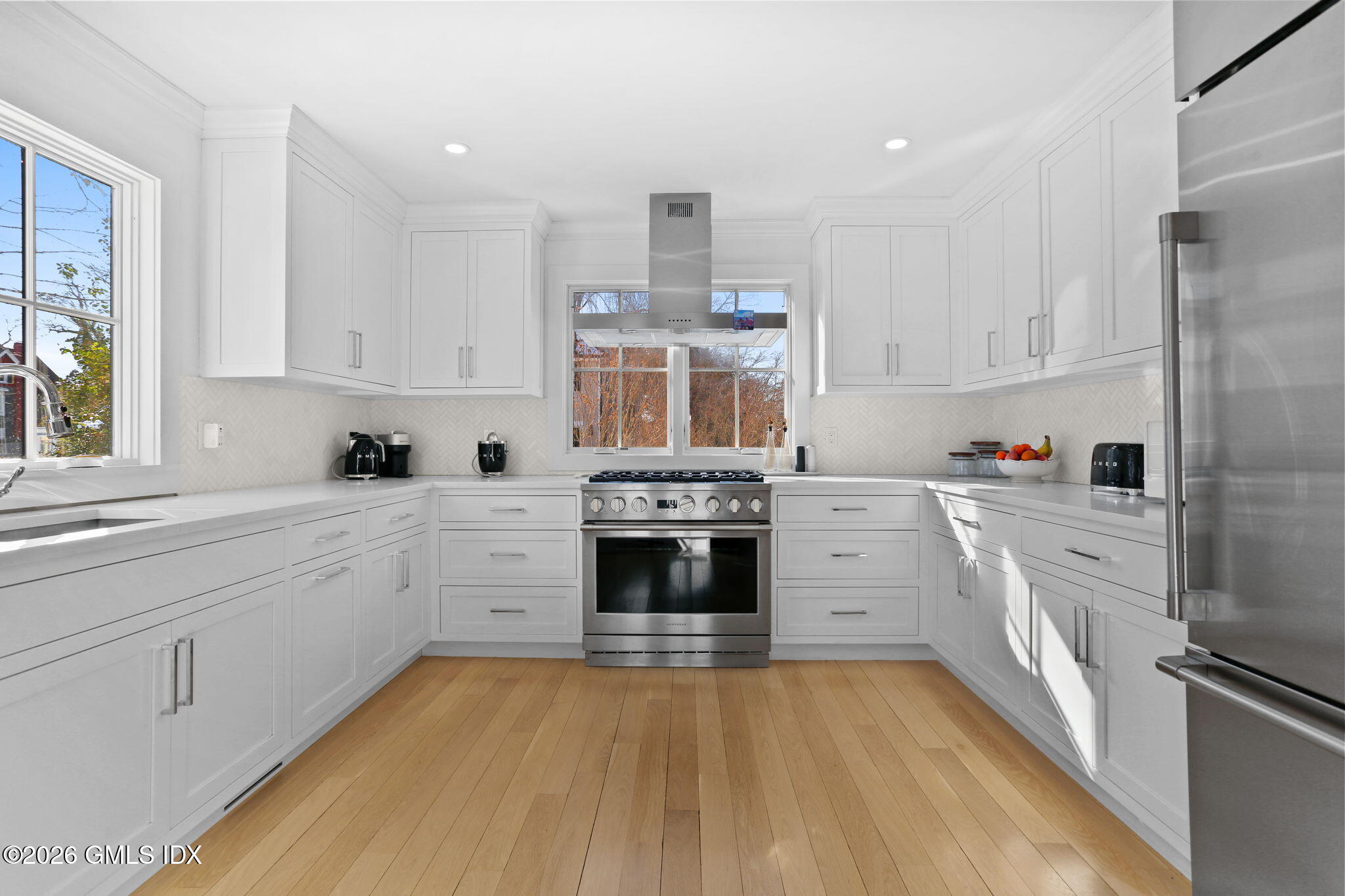 10 Lockwood Road Riverside, CT 06878 - Photo 8 of 38 a kitchen with stainless steel appliances granite countertop a stove and cabinets