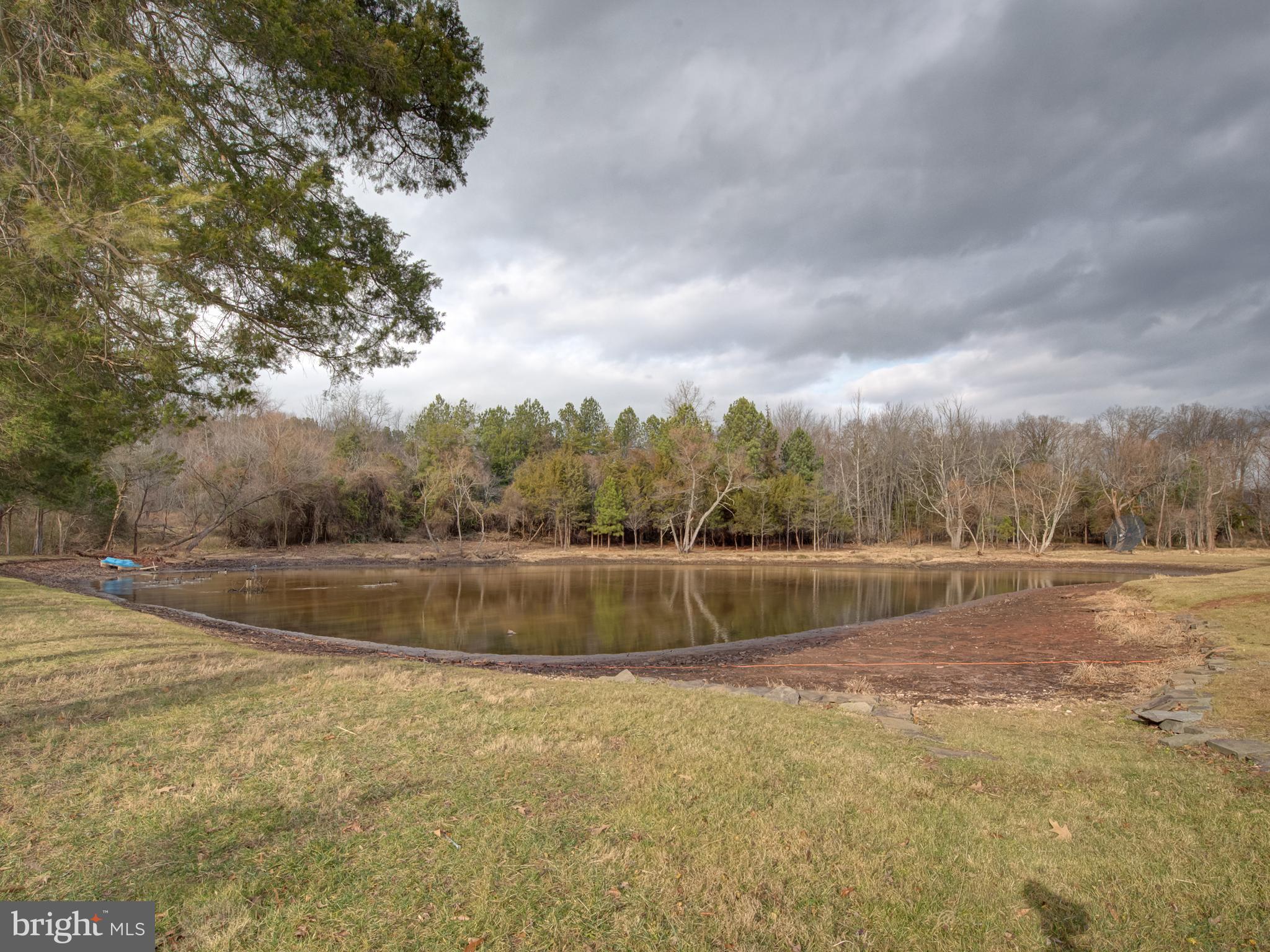 1108 B Shaker Woods Road Herndon, VA 20170 - Photo 20 of 24 a view of a lake with trees in the background