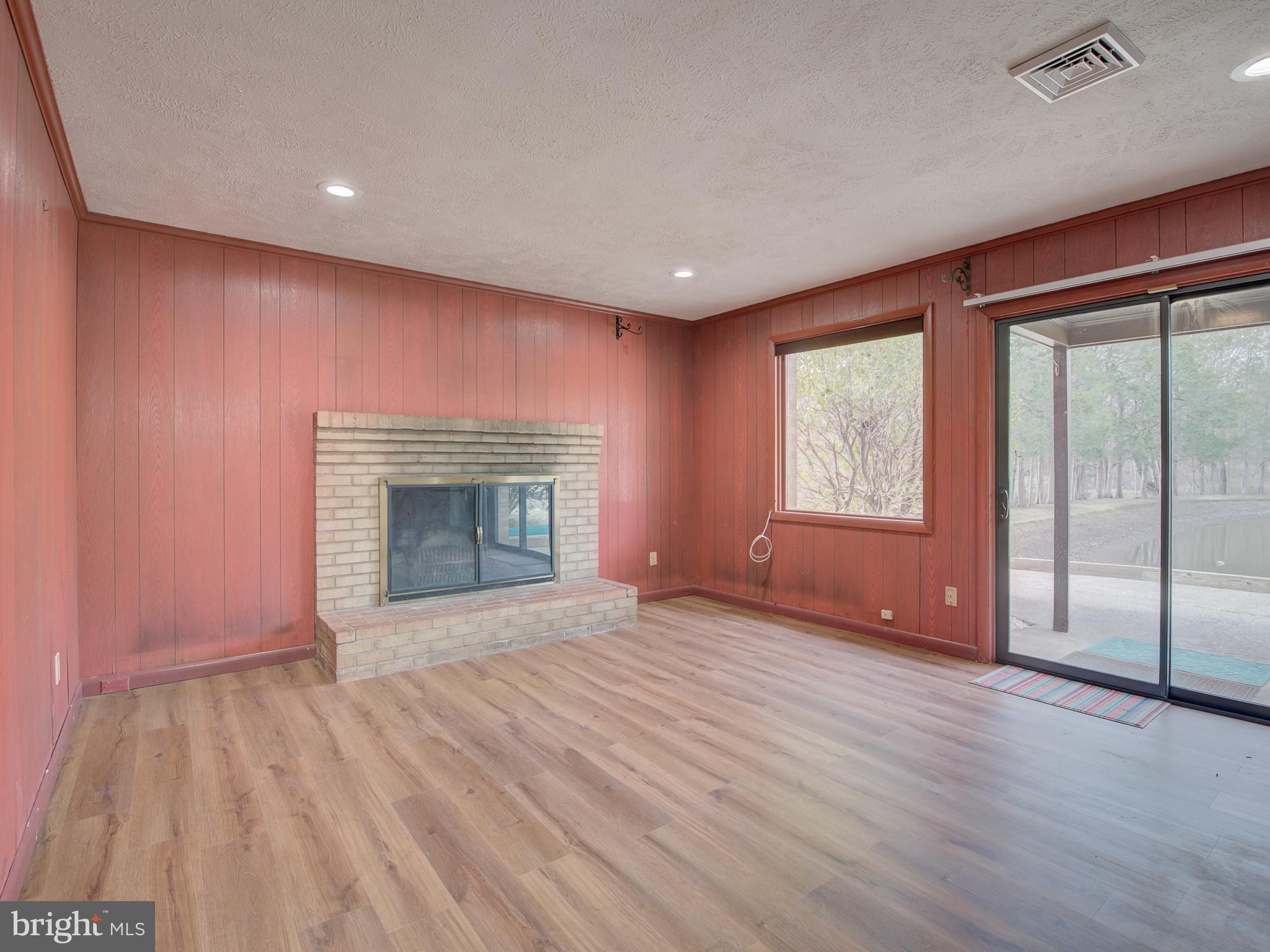 1108 B Shaker Woods Road Herndon, VA 20170 - Photo 3 of 24 an empty room with windows and fireplace