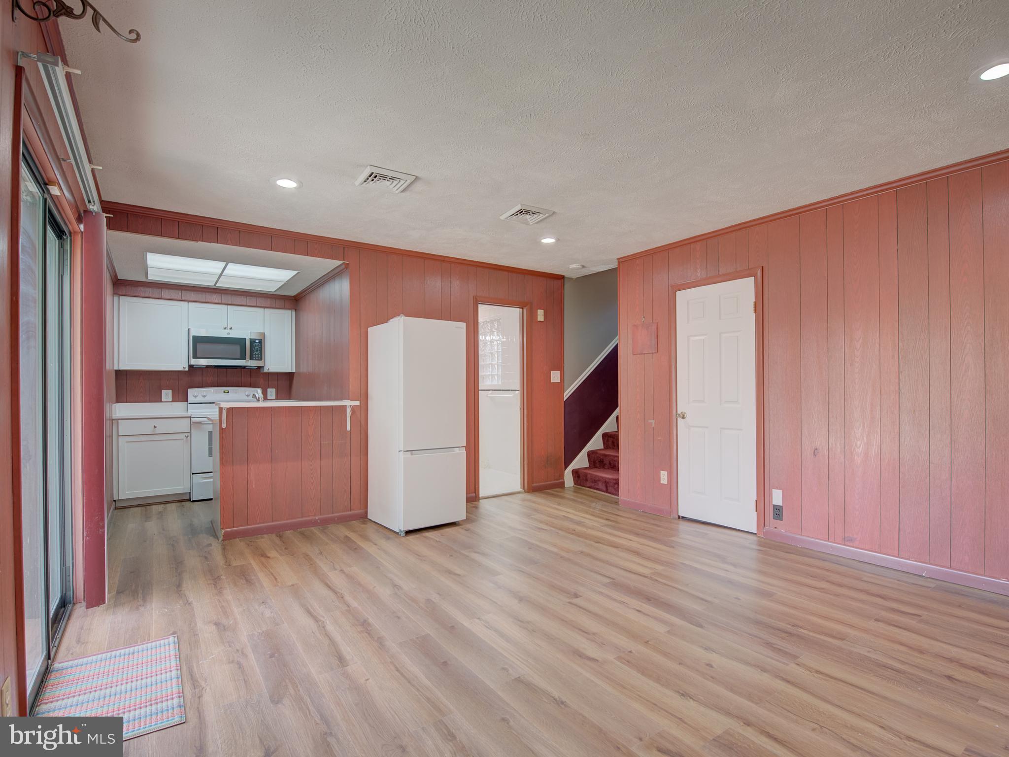 1108 B Shaker Woods Road Herndon, VA 20170 - Photo 6 of 24 a view of empty room with wooden floor