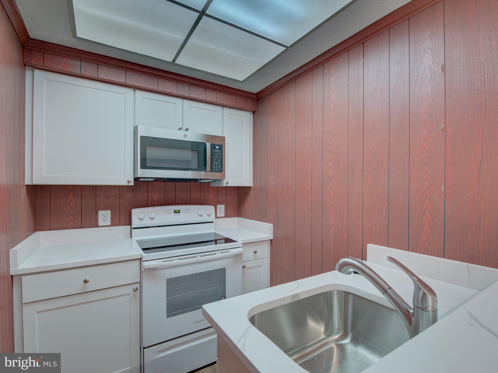 1108 B Shaker Woods Road Herndon, VA 20170 - Photo 8 of 24 a view of storage and utility room with washer and dryer