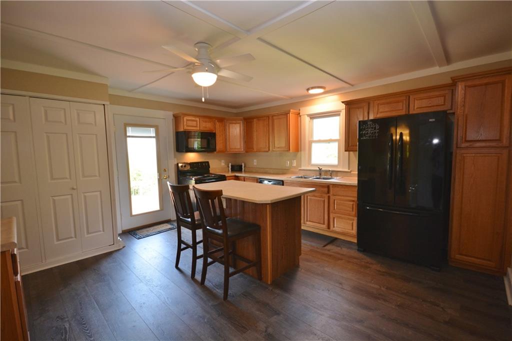 Beautifully updated kitchen with new appliances, convenient island, huge pantry. 