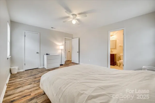 a large white bed in a white room