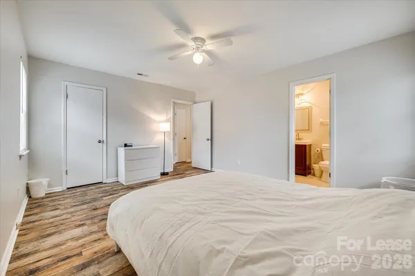 a large white bed in a white room