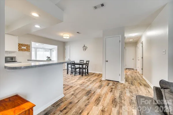a living room with furniture and a table