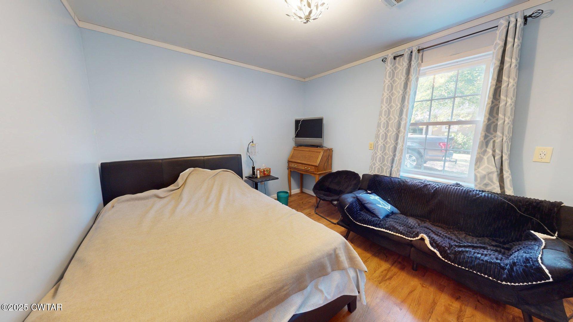 310 North Grayson Street Newbern, TN 38059 - Photo 13 of 22 a bed room with two bed and a couch