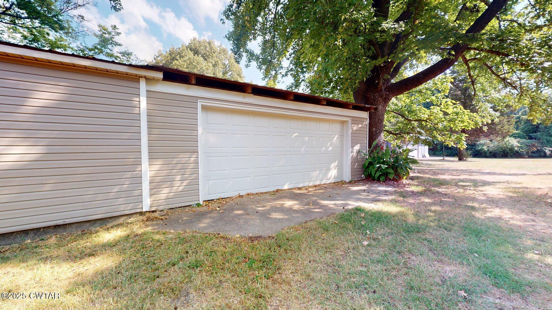 310 North Grayson Street Newbern, TN 38059 - Photo 15 of 22 a view of backyard of house