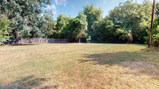 a view of a swimming pool and trees