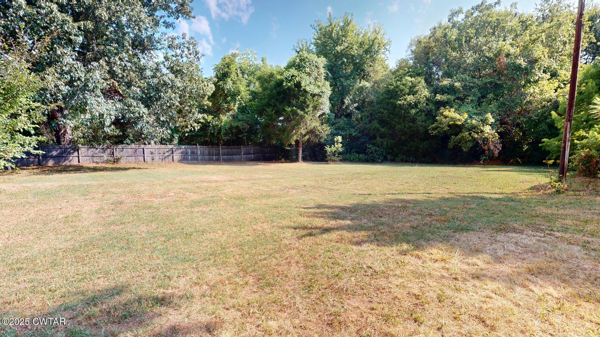 310 North Grayson Street Newbern, TN 38059 - Photo 21 of 22 a view of a swimming pool and trees