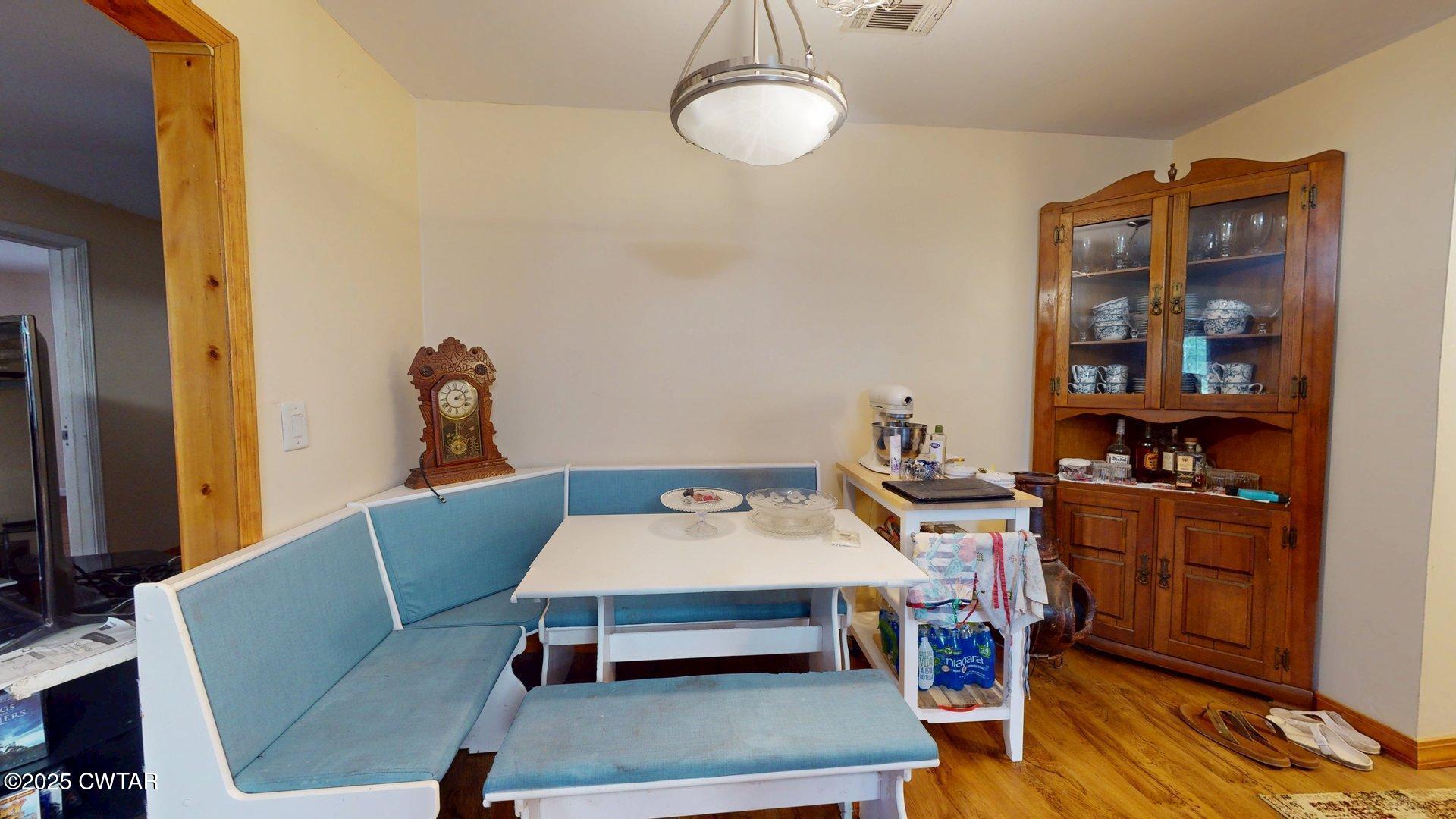 310 North Grayson Street Newbern, TN 38059 - Photo 4 of 22 a room with furniture and wooden floor