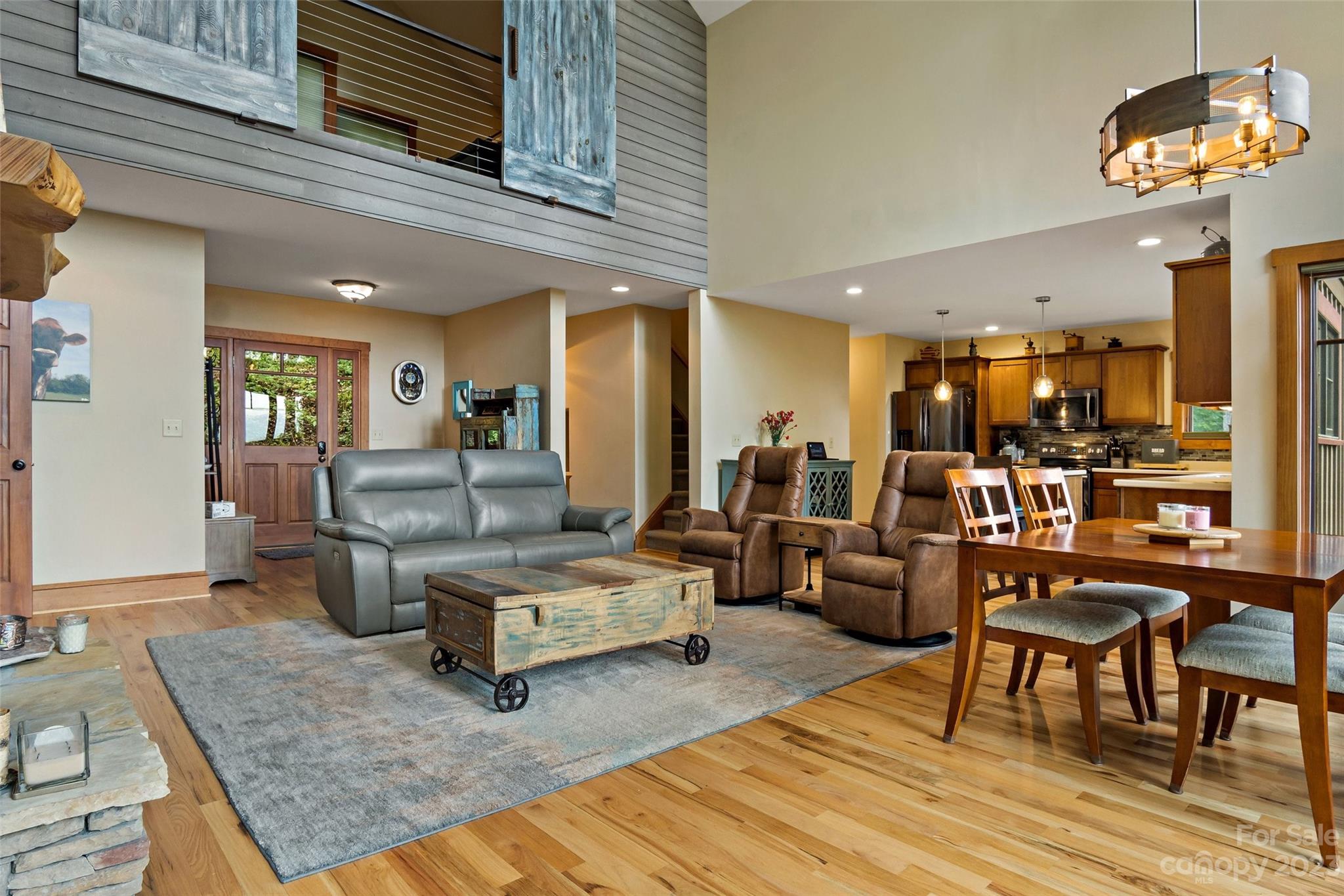 610 Creston Drive Black Mountain, NC 28711 - Photo 11 of 47 a living room with furniture and a chandelier
