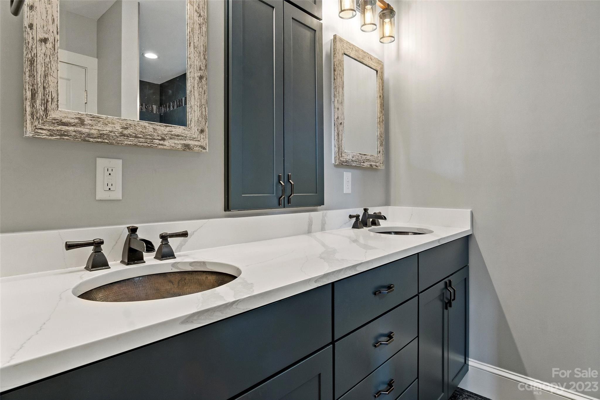 610 Creston Drive Black Mountain, NC 28711 - Photo 27 of 47 a bathroom with a sink and a mirror