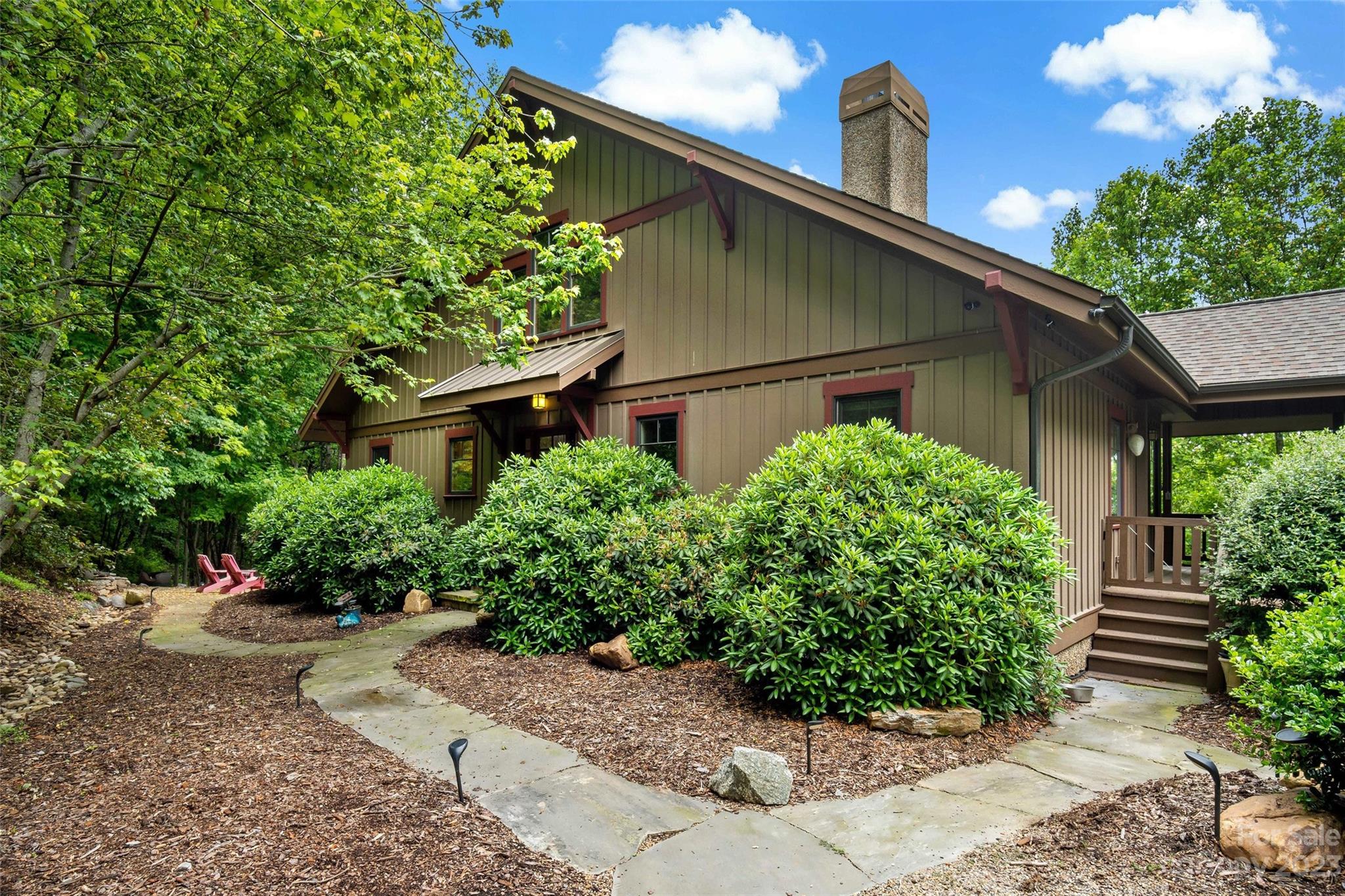 610 Creston Drive Black Mountain, NC 28711 - Photo 3 of 47 a house view with a garden space