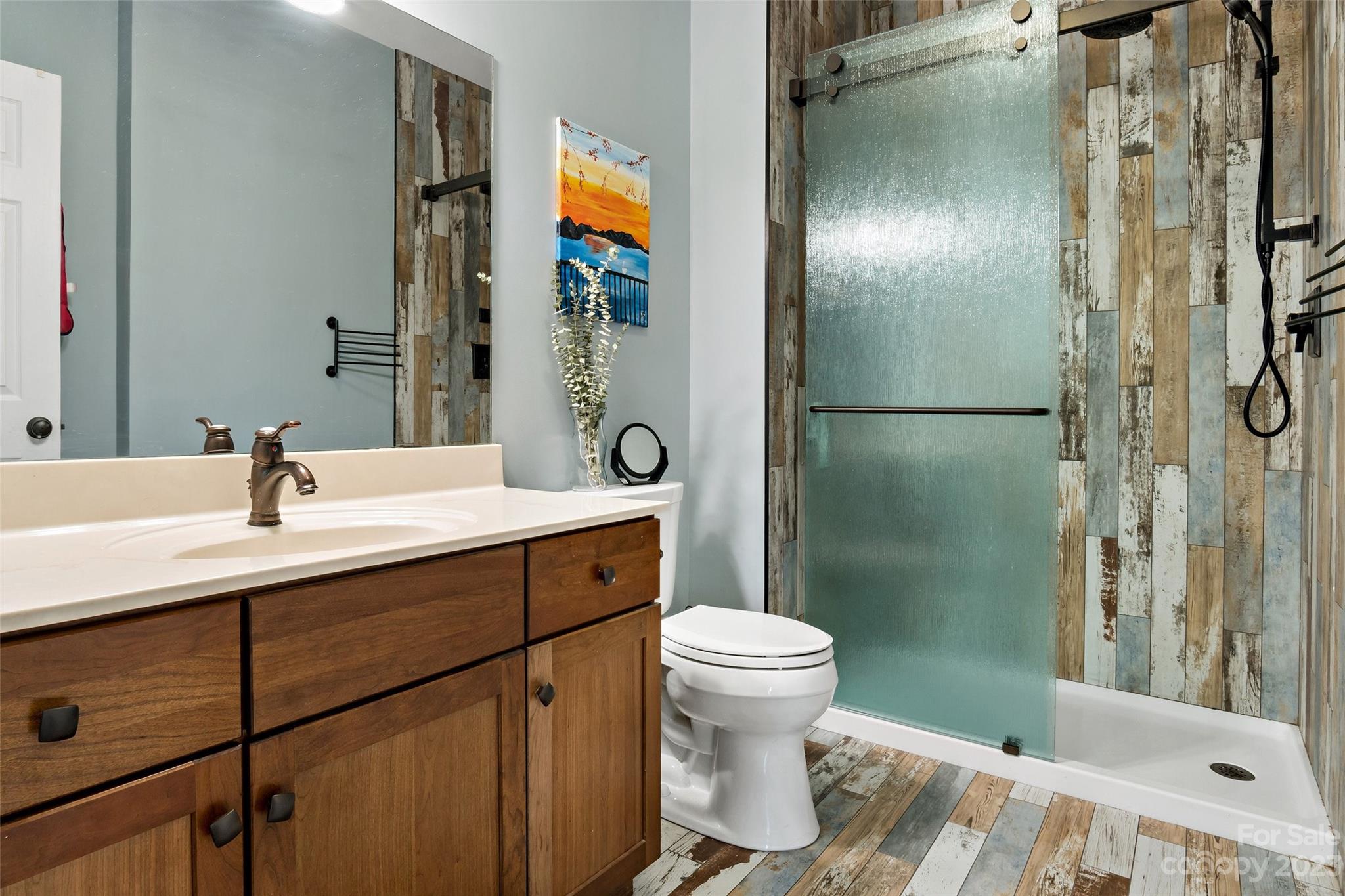 610 Creston Drive Black Mountain, NC 28711 - Photo 42 of 47 a bathroom with a sink and a mirror