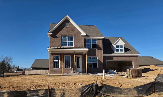 a front view of a house with a ocean view