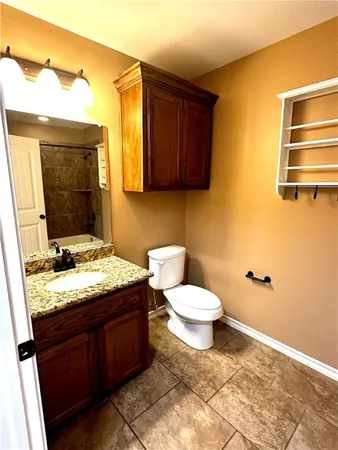 a bathroom with a shower and a bath tub