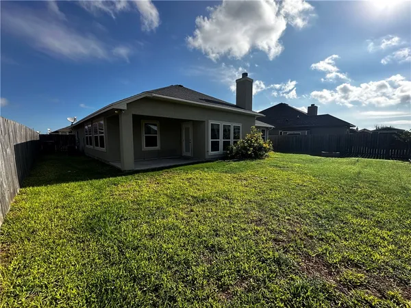 a view of a backyard with garden