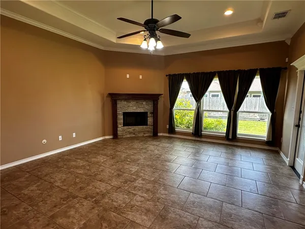 a kitchen with granite countertop cabinets stainless steel appliances a sink and a window