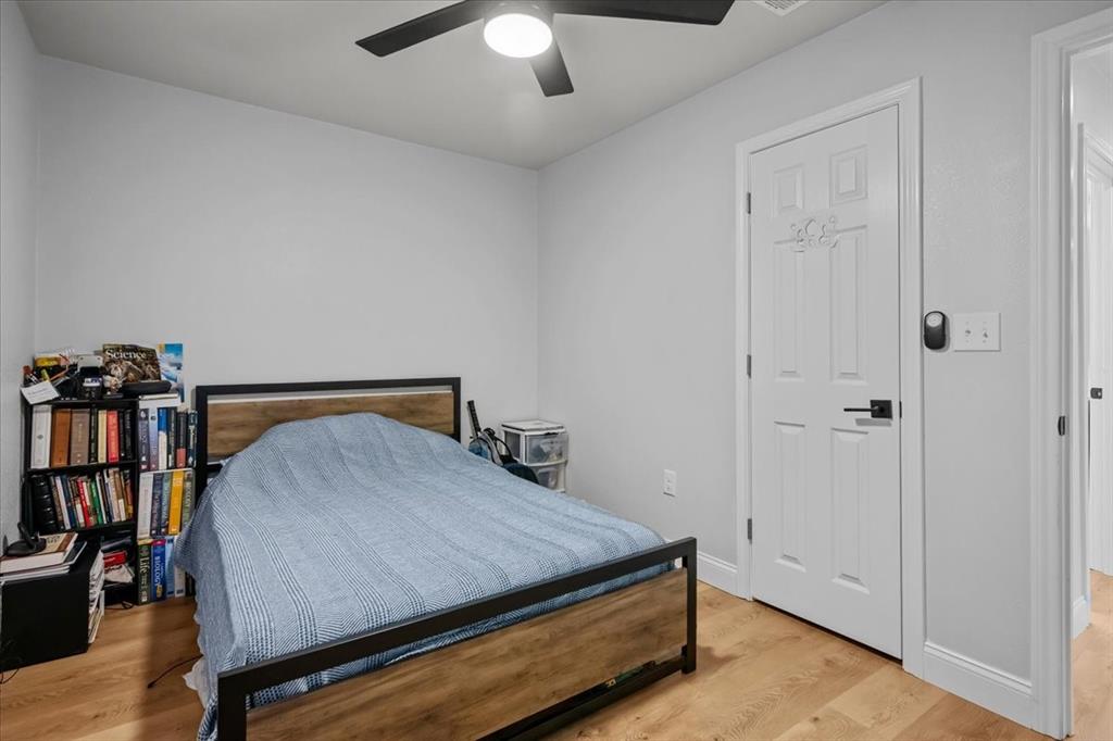2804 Connor Avenue Waco, TX 76711 - Photo 12 of 21 a bed sitting in a bedroom next to a book shelf