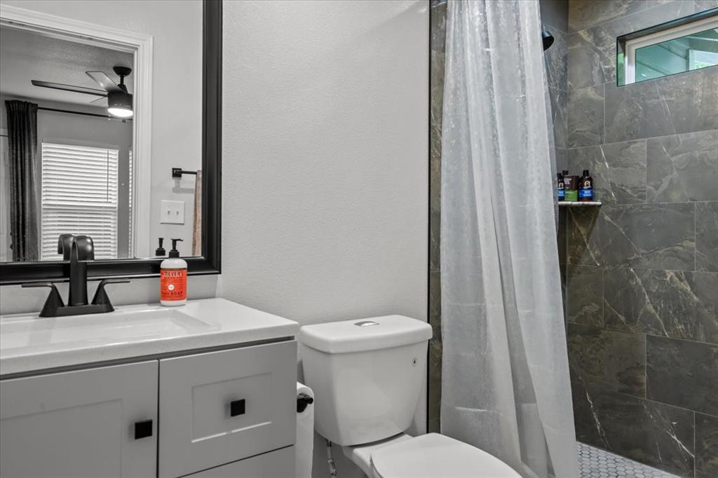 2804 Connor Avenue Waco, TX 76711 - Photo 17 of 21 a bathroom with a sink and a mirror