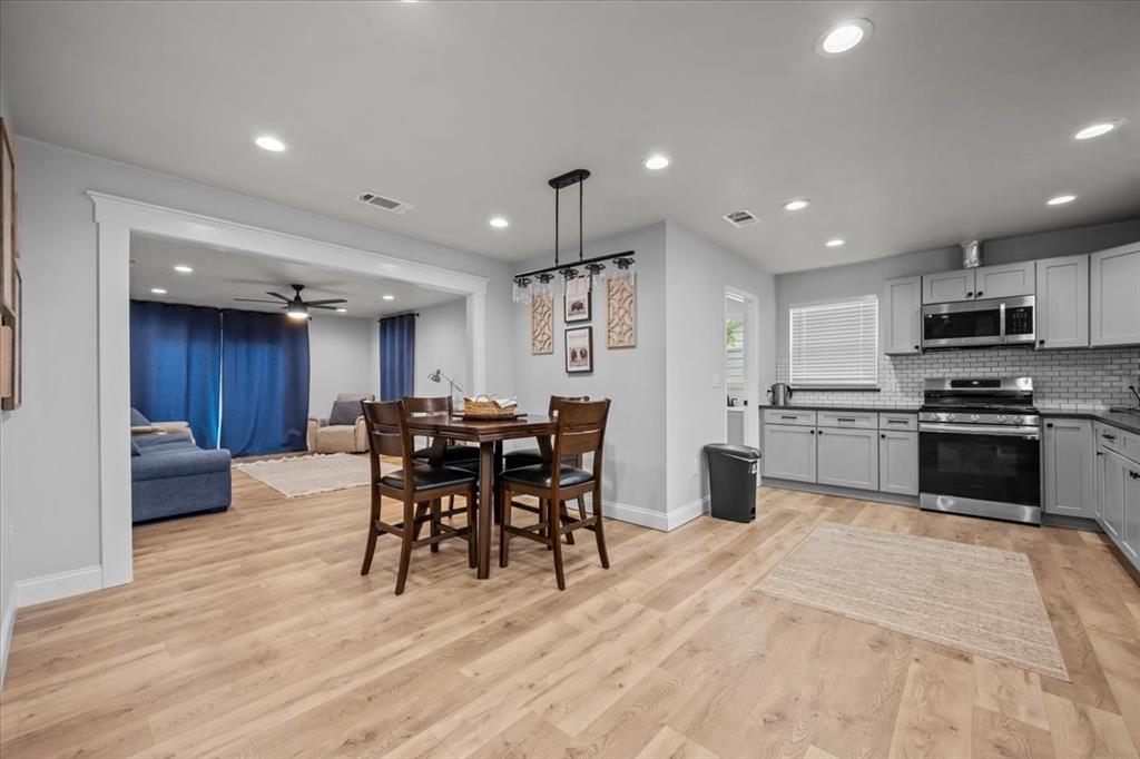 2804 Connor Avenue Waco, TX 76711 - Photo 4 of 21 a kitchen with stainless steel appliances kitchen island granite countertop a table chairs sink and cabinets
