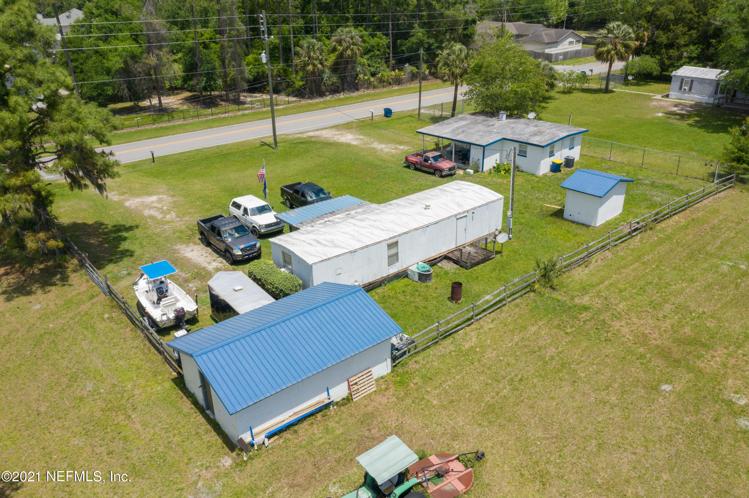 3682 Starratt Road Jacksonville, FL 32226 - Photo 19 of 19 Back of Mobile Home and House