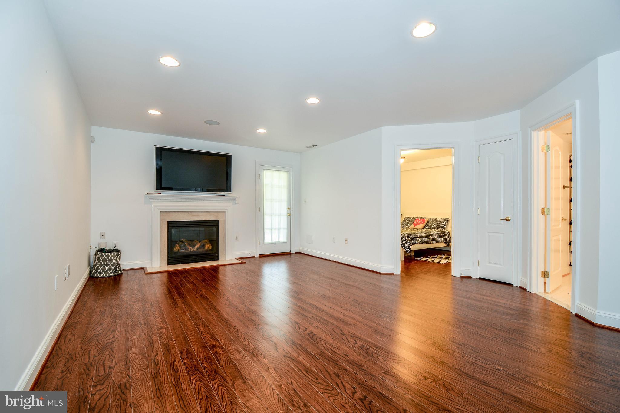 6401 Velliety Lane Springfield, VA 22152 - Photo 33 of 38 Walk out lower level family room with fireplace