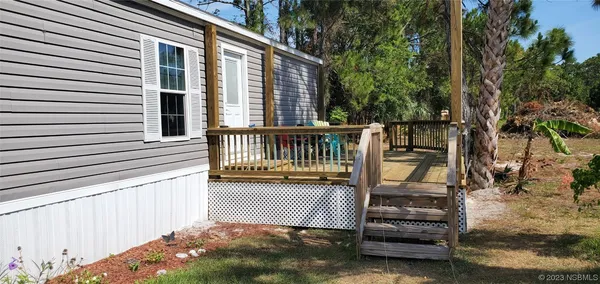 a view of a porch with furniture
