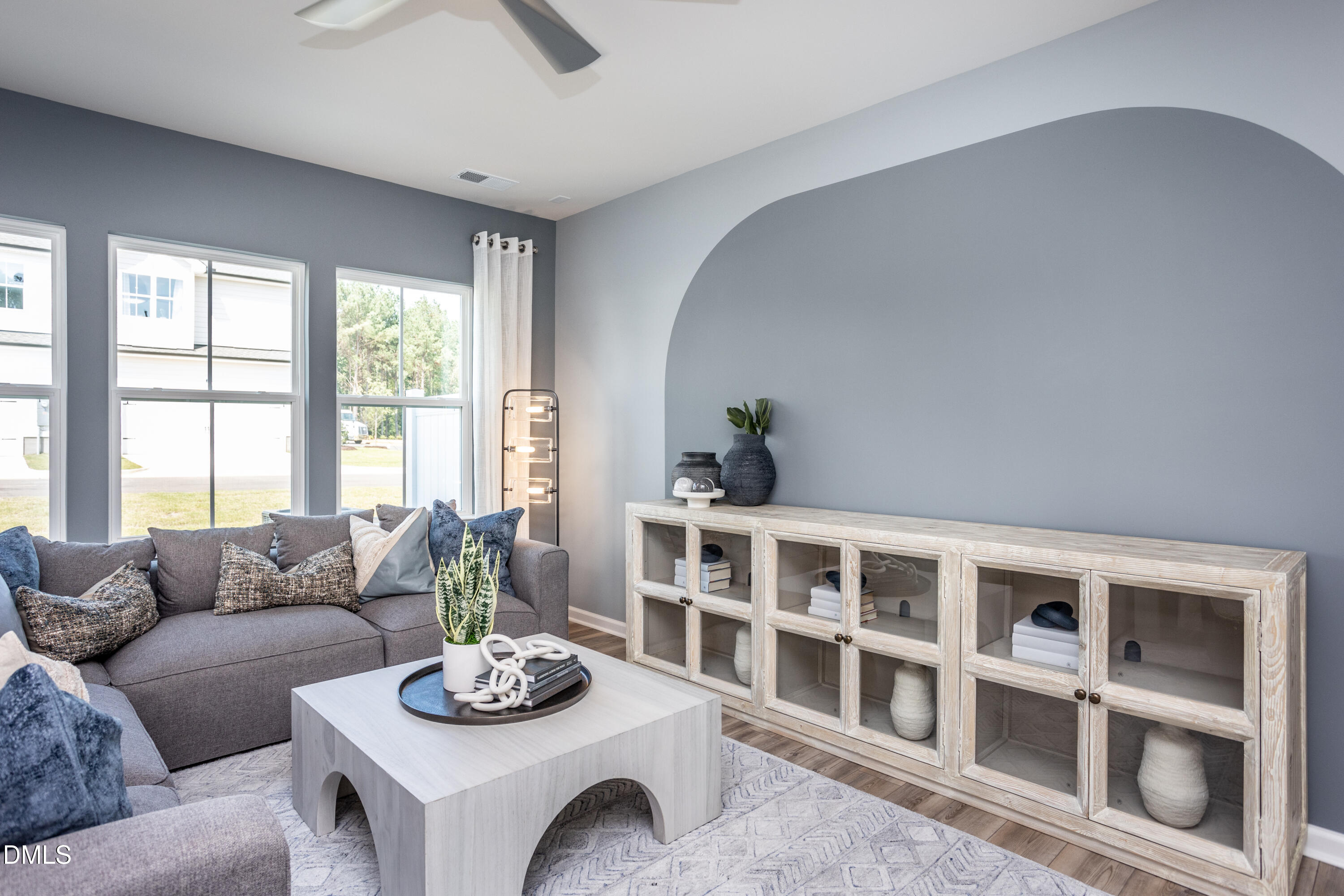 2859 Rodeo Court Fuquay-Varina, NC 27526 - Photo 8 of 23 a living room with furniture and a large window