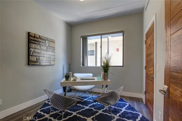 a living room with a couch and a window