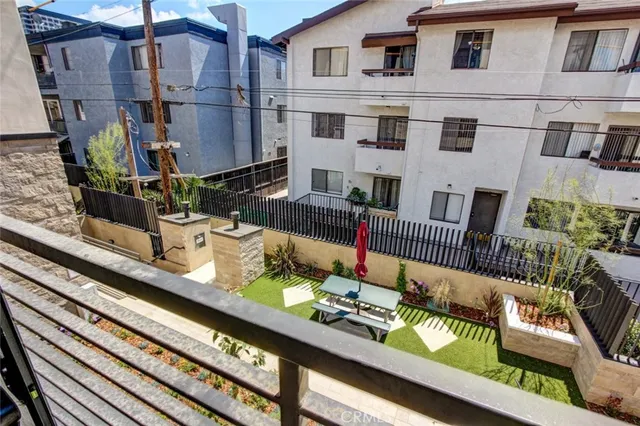 a view of a chairs and table in the balcony
