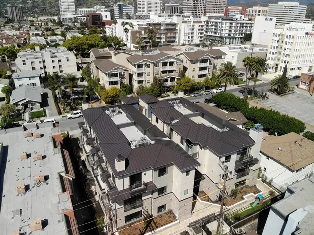 an aerial view of residential houses with outdoor space