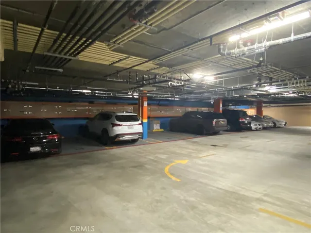 a view of parking garage with cars