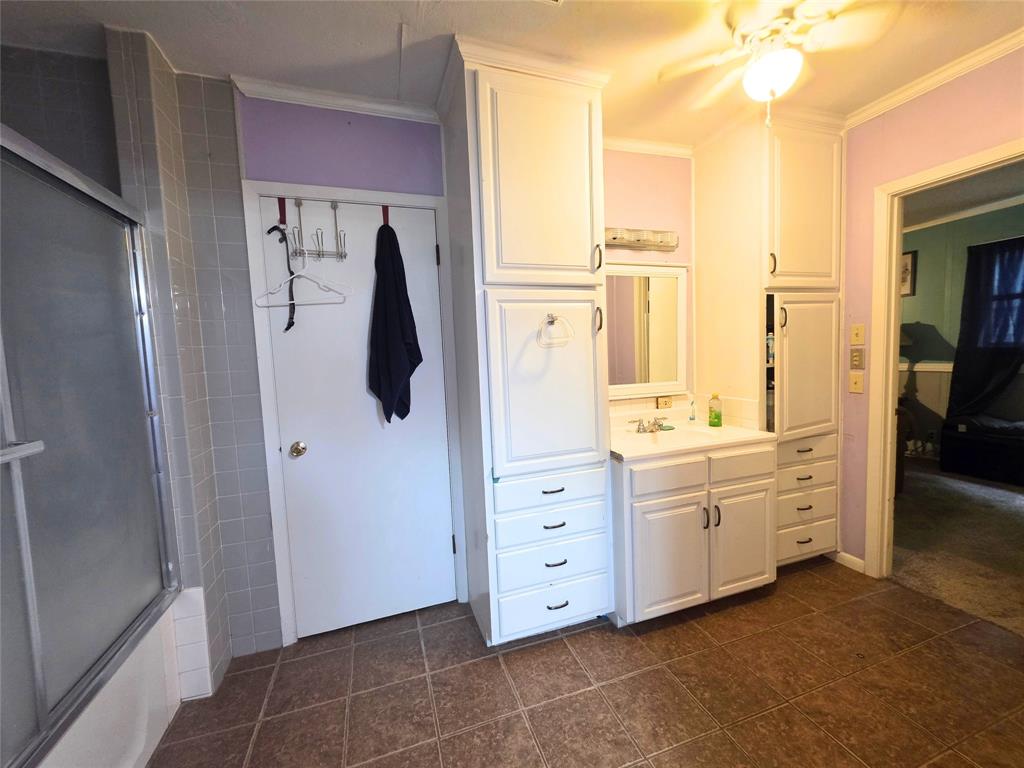 4214 Valview Drive Waco, TX 76708 - Photo 14 of 23 a bathroom with a double vanity sink a mirror and shower