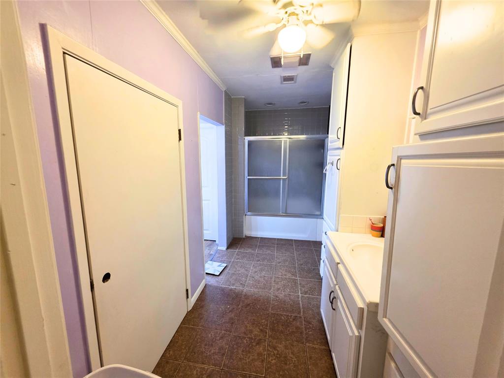 4214 Valview Drive Waco, TX 76708 - Photo 15 of 23 a bathroom with a sink a toilet and shower
