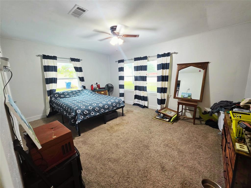 4214 Valview Drive Waco, TX 76708 - Photo 17 of 23 a bedroom with bed and a mirror