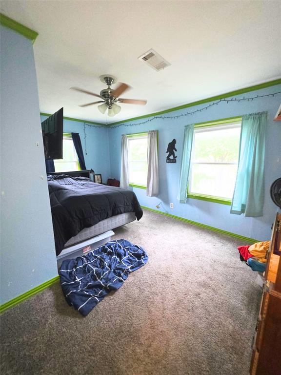 4214 Valview Drive Waco, TX 76708 - Photo 19 of 23 a living room with furniture and a flat screen tv