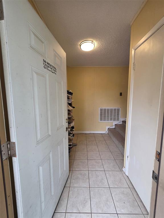 4214 Valview Drive Waco, TX 76708 - Photo 3 of 23 a view of entryway with stairs and a door