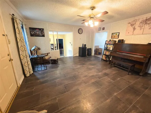 a dining room with furniture and a rug