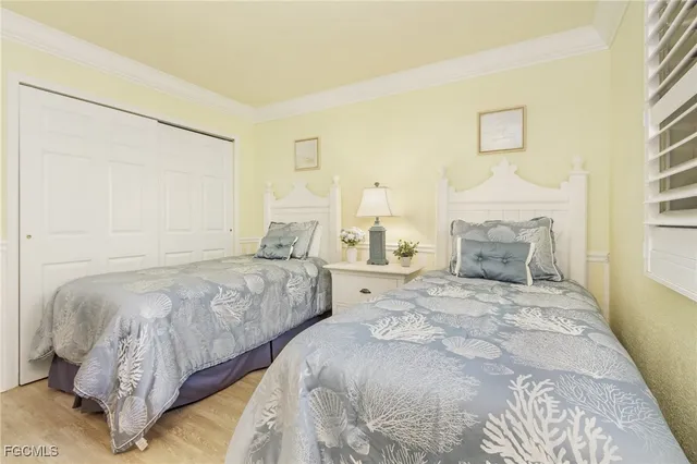 a bedroom with double bed and a window