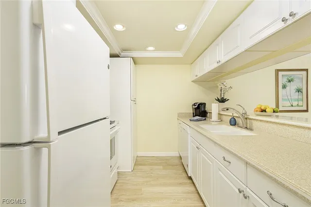 a spacious bathroom with a double vanity sink and mirror