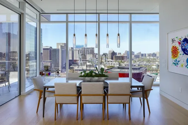 a view of a dining room with furniture and window