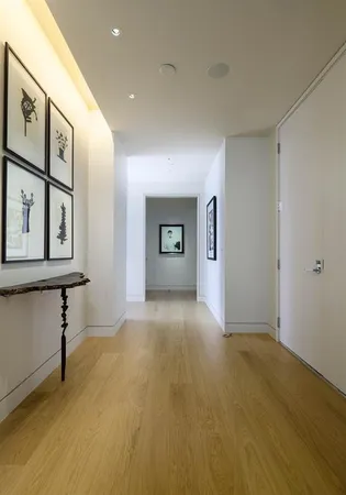 a view of a big room with windows and cabinet