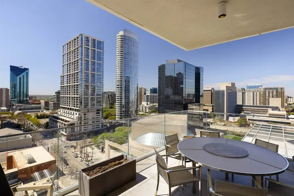 a large kitchen with a table and chairs