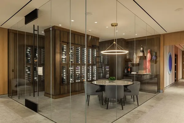 a room with chairs a table and chairs